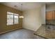 Cozy dining area adjacent to the kitchen with a large window at 4017 Gliding Gulls Ave, North Las Vegas, NV 89084
