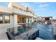 Modern backyard with a luxurious pool, spa, outdoor kitchen, and cozy seating areas for ultimate relaxation at 4024 Desert Trace Ct, Las Vegas, NV 89129