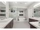A luxurious bathroom with a soaking tub, glass shower, double sink vanity and modern fixtures at 4024 Desert Trace Ct, Las Vegas, NV 89129