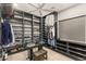 Spacious walk-in closet with custom shelving and ample storage for clothes and accessories at 4024 Desert Trace Ct, Las Vegas, NV 89129
