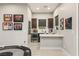 Entertaining game room featuring a bar, wine fridge, and custom lighting for memorable gatherings at 4024 Desert Trace Ct, Las Vegas, NV 89129