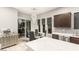 Modern kitchen with a large island, stainless steel appliances, and stylish lighting fixtures at 4024 Desert Trace Ct, Las Vegas, NV 89129