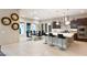 Elegant kitchen featuring modern appliances, a large island, a breakfast bar, and a dining area at 4024 Desert Trace Ct, Las Vegas, NV 89129