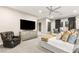 Spacious main bedroom featuring a comfortable seating area, TV and elegant decor for a relaxing retreat at 4024 Desert Trace Ct, Las Vegas, NV 89129