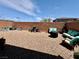 Low-maintenance backyard with comfortable outdoor seating, gravel, and a brick perimeter wall at 4132 Ancient Well Ct, Las Vegas, NV 89135