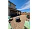 Spacious, low-maintenance backyard with comfortable seating, a covered patio, and beautiful landscaping at 4132 Ancient Well Ct, Las Vegas, NV 89135