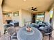 Stylish backyard patio with a table, comfortable seating, and a grill at 4132 Ancient Well Ct, Las Vegas, NV 89135