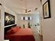 Comfortable bedroom features a ceiling fan, hardwood floors, and vibrant decorations at 4132 Ancient Well Ct, Las Vegas, NV 89135