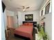 Comfortable bedroom features a ceiling fan, hardwood floors, and vibrant decorations at 4132 Ancient Well Ct, Las Vegas, NV 89135