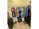 Organized closet with hanging space, drawers, and a stool, providing efficient storage solutions at 4132 Ancient Well Ct, Las Vegas, NV 89135
