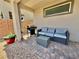 Cozy covered patio with a grill, outdoor seating, and low-maintenance landscaping at 4132 Ancient Well Ct, Las Vegas, NV 89135