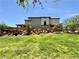 Contemporary two-story home showcasing a well-manicured lawn and tidy shrubbery at 4132 Ancient Well Ct, Las Vegas, NV 89135