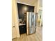 The kitchen features a stainless steel refrigerator and black cabinets at 4132 Ancient Well Ct, Las Vegas, NV 89135