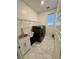 A functional laundry room with washer, dryer, utility sink, and storage, designed for convenience at 4132 Ancient Well Ct, Las Vegas, NV 89135