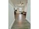 Open living room with hardwood floors, ceiling fan, and modern furnishings at 4132 Ancient Well Ct, Las Vegas, NV 89135