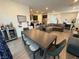 Open concept living/dining room featuring modern furnishings and stylish decor at 4132 Ancient Well Ct, Las Vegas, NV 89135