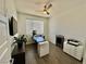Bright office featuring hardwood floors, modern desk, and a ceiling fan at 4132 Ancient Well Ct, Las Vegas, NV 89135