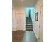 Stairway to second floor with carpet runner and white railing leading to the upper level at 4132 Ancient Well Ct, Las Vegas, NV 89135