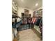 Organized walk-in closet with ample storage for shoes, clothing, and accessories, creating an efficient wardrobe space at 4132 Ancient Well Ct, Las Vegas, NV 89135
