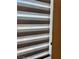 Sleek window treatment providing light control, privacy, and a contemporary accent to the room's interior at 4132 Ancient Well Ct, Las Vegas, NV 89135
