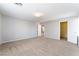 Spacious bedroom featuring neutral carpet, paint and walk in closet at 4133 Perfect Lure St, Las Vegas, NV 89129
