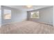 Bright bedroom featuring neutral carpet, paint and natural light at 4133 Perfect Lure St, Las Vegas, NV 89129