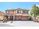 Inviting two-story home featuring a three-car garage and well-maintained front yard at 4133 Perfect Lure St, Las Vegas, NV 89129