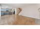 Open-concept living room showcases tile floors, a staircase, and access to the kitchen at 4133 Perfect Lure St, Las Vegas, NV 89129