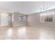 Bright living room with tile floors, multiple windows, and modern lighting fixtures at 4133 Perfect Lure St, Las Vegas, NV 89129