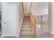Carpeted stairway with wooden railing near a white door at 4133 Perfect Lure St, Las Vegas, NV 89129