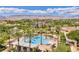 A stunning aerial view captures the community's pool, lush landscaping, and desert surroundings at 4187 Pacifico Ln, Las Vegas, NV 89135