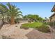 Backyard with artificial turf and desert landscaping at 4187 Pacifico Ln, Las Vegas, NV 89135