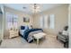 Tranquil bedroom featuring soft carpet, plantation shutters, and a coordinated color scheme with stylish furnishings at 4187 Pacifico Ln, Las Vegas, NV 89135