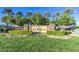 Beautifully landscaped entrance to the Siena community featuring mature trees and lush green grass at 4187 Pacifico Ln, Las Vegas, NV 89135