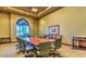 A well-lit conference room features a large table, comfortable seating, and a bright window at 4187 Pacifico Ln, Las Vegas, NV 89135