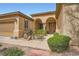 Charming home with well-maintained landscaping, front yard trees, and double door entry at 4187 Pacifico Ln, Las Vegas, NV 89135