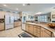 A view of the kitchen, with the living area visible in the background at 4187 Pacifico Ln, Las Vegas, NV 89135