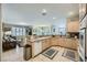 Open kitchen layout with stainless steel appliances and seamless flow into the living area at 4187 Pacifico Ln, Las Vegas, NV 89135
