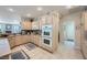 Bright kitchen features tiled floor, stainless steel appliances and granite counters at 4187 Pacifico Ln, Las Vegas, NV 89135