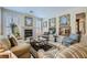 Comfortable living room with plantation shutters, fireplace, and an elegant seating arrangement at 4187 Pacifico Ln, Las Vegas, NV 89135