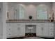 Elegant bathroom featuring double vanity, modern fixtures, and stylish tile work at 4594 Blue Mesa Way, Las Vegas, NV 89129
