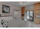 Bedroom with a comfortable bed, a built-in bookcase, and a sliding door to the backyard at 4594 Blue Mesa Way, Las Vegas, NV 89129