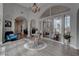 Inviting foyer with high ceilings, statement lighting, and archways leading to living areas, showcases modern decor and design at 4594 Blue Mesa Way, Las Vegas, NV 89129