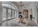 Airy foyer boasts a soaring ceiling, elegant chandelier, and decorative doorway leading to a formal living space at 4594 Blue Mesa Way, Las Vegas, NV 89129