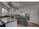 The kitchen is equipped with stainless steel appliances, a central island, and granite counters at 4594 Blue Mesa Way, Las Vegas, NV 89129