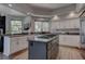 Kitchen featuring granite countertops, a central island, and stainless steel appliances at 4594 Blue Mesa Way, Las Vegas, NV 89129