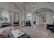 Expansive living area with high ceilings, archways, and seamless indoor-outdoor flow at 4594 Blue Mesa Way, Las Vegas, NV 89129
