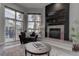 Contemporary living room with fireplace and access to pool area, perfect for entertaining at 4594 Blue Mesa Way, Las Vegas, NV 89129
