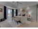 Serene main bedroom with elegant decor, large windows, and a cozy ambiance at 4594 Blue Mesa Way, Las Vegas, NV 89129