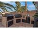 Outdoor kitchen area featuring a built-in barbecue and outdoor appliances at 4594 Blue Mesa Way, Las Vegas, NV 89129
